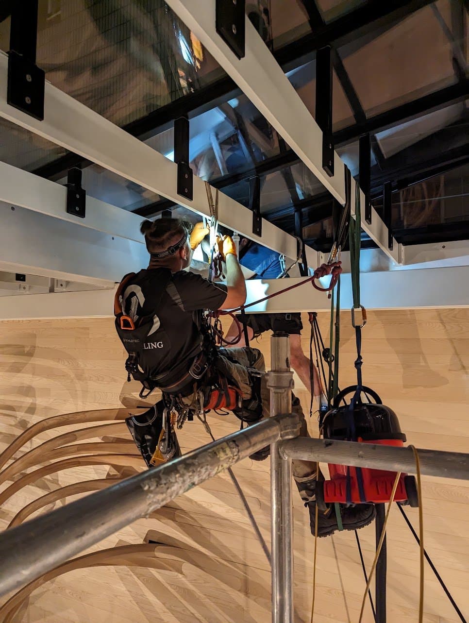Overhead cleaning of the rooflight glazing and its steel beams at night