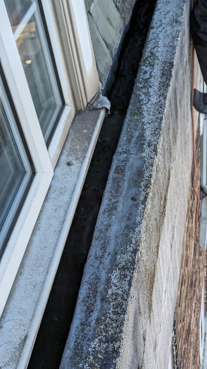 After: the same gutter cleared back to its lining