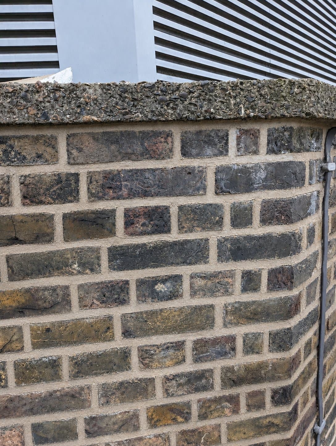 After: clean uniform mortar joints beneath the coping