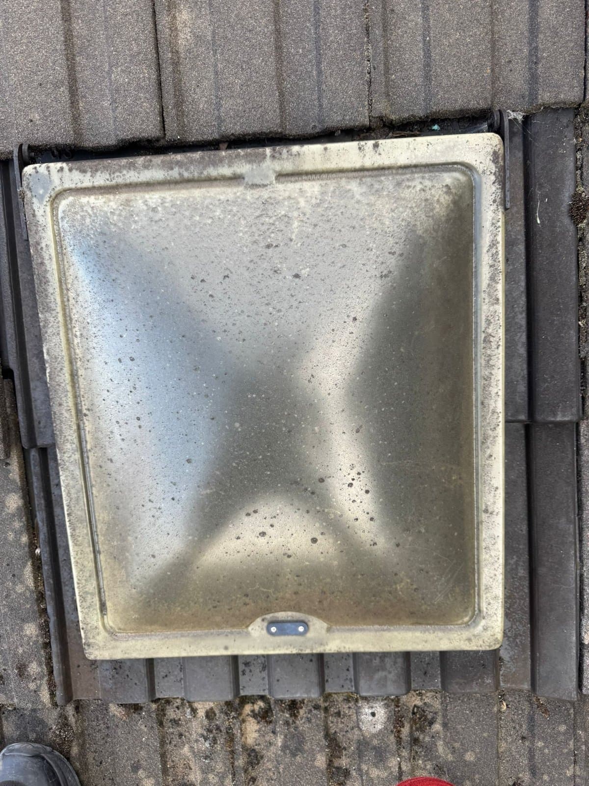 Before: the old domed rooflight, opaque and deteriorated with mould around the frame
