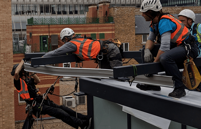 Facade installation and cleaning package project image showing rope access installation support